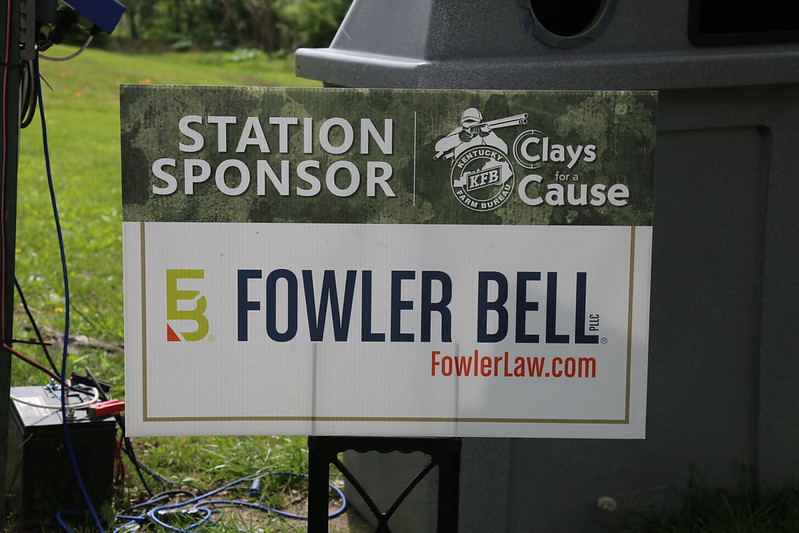 A small sign that says "Fowler Bell", "Station Sponsor", and "Clays Cause".