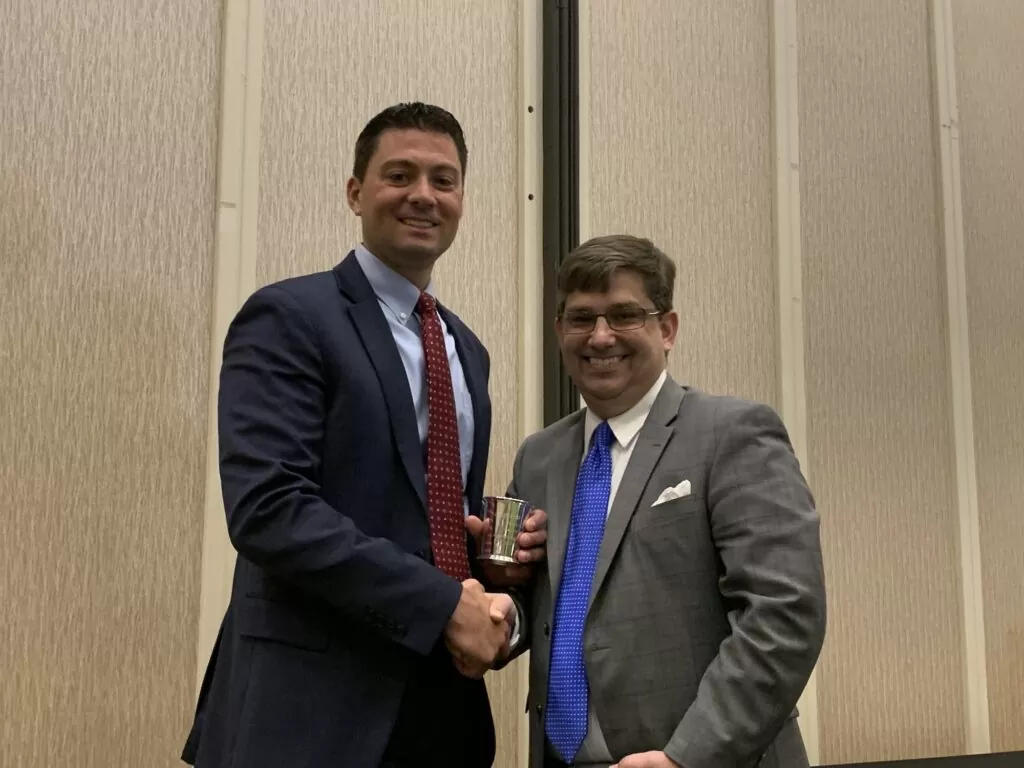 Christopher Colson hands gavel to incoming President of FCBA, Steve Sadler
