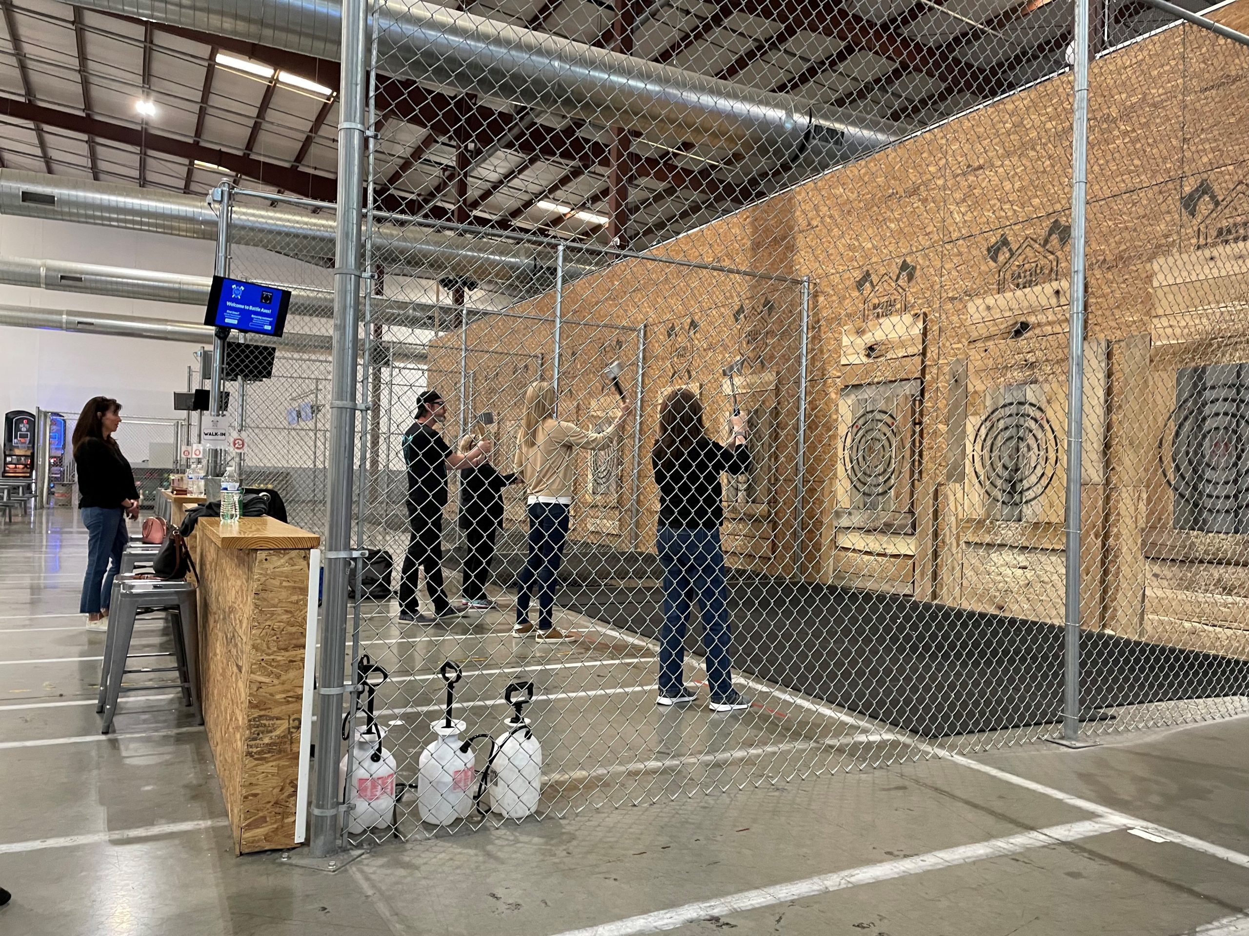 Staff practicing axe throwing
